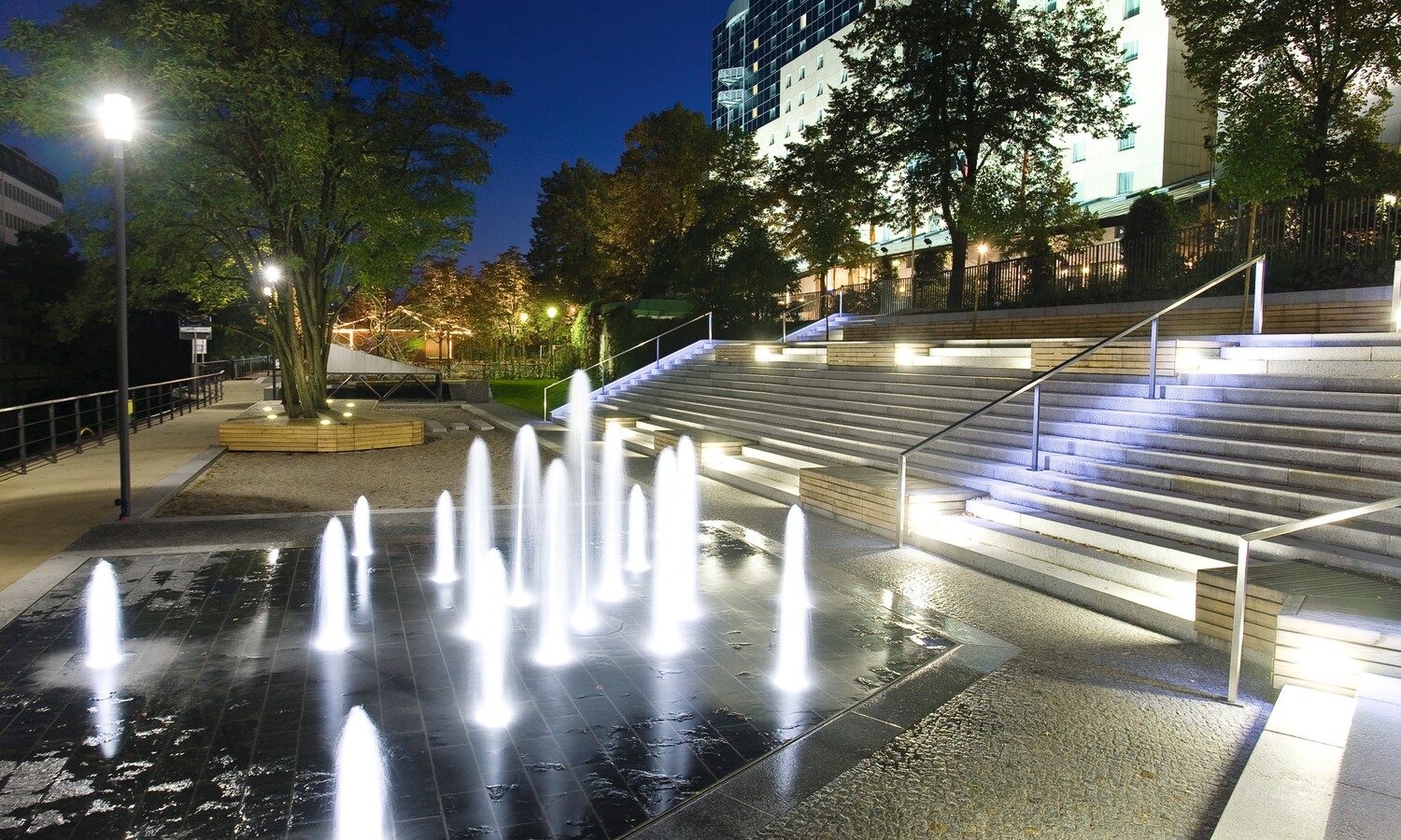 Estrel summer garden with water fountain by night