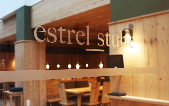 Logo lettering of the Estrel Stube at the entrance