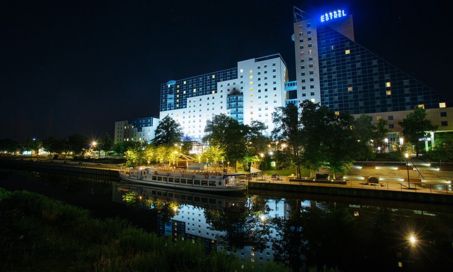 Illuminated Estrel Summer garden and landing pier by night